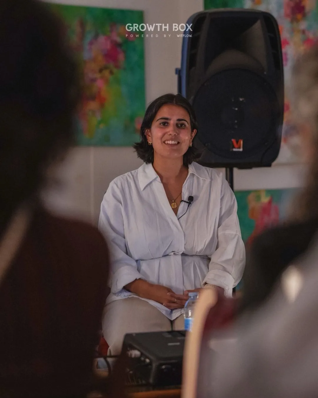 Mariana listening during the Growth Box conversation in Lagos